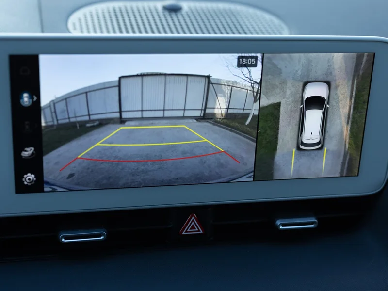 Surround-view camera display showing its guidance overlay on a dashboard screen