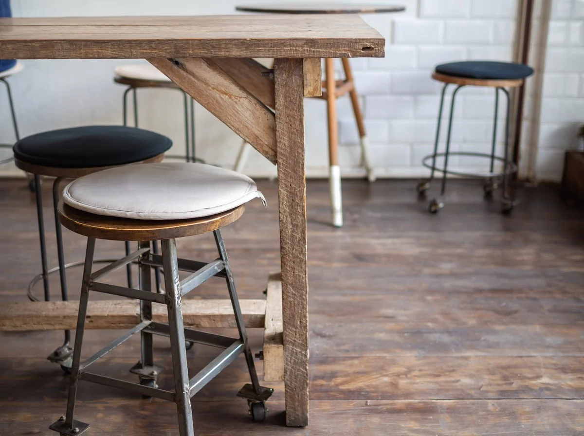 Worn timber floor and entrance threshold of a bar room