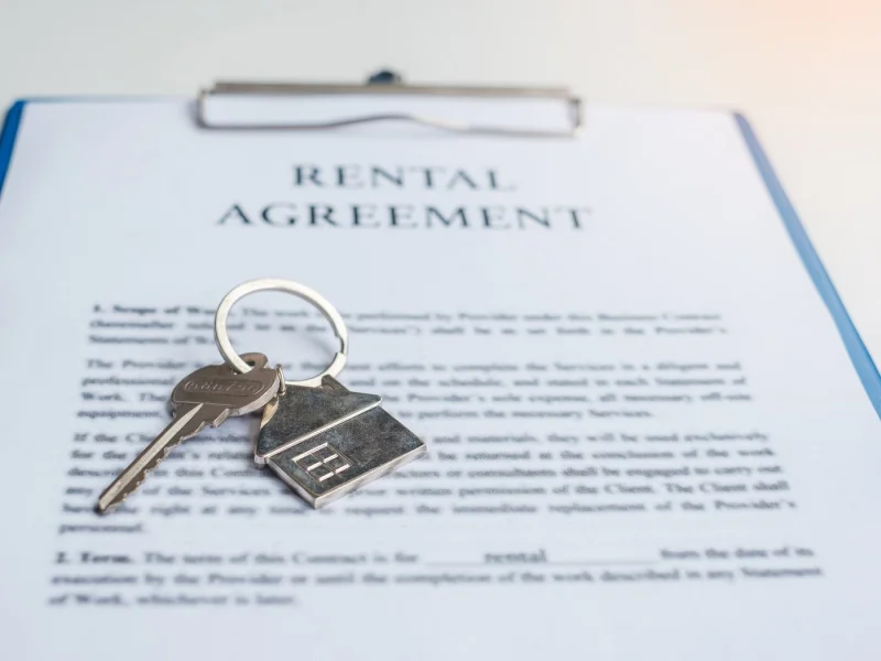 Rental agreement on a clipboard with a set of keys resting on it