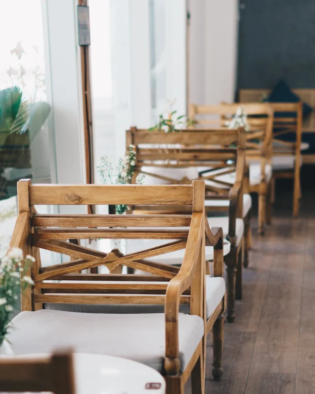 Empty restaurant interior with chairs stacked on tables