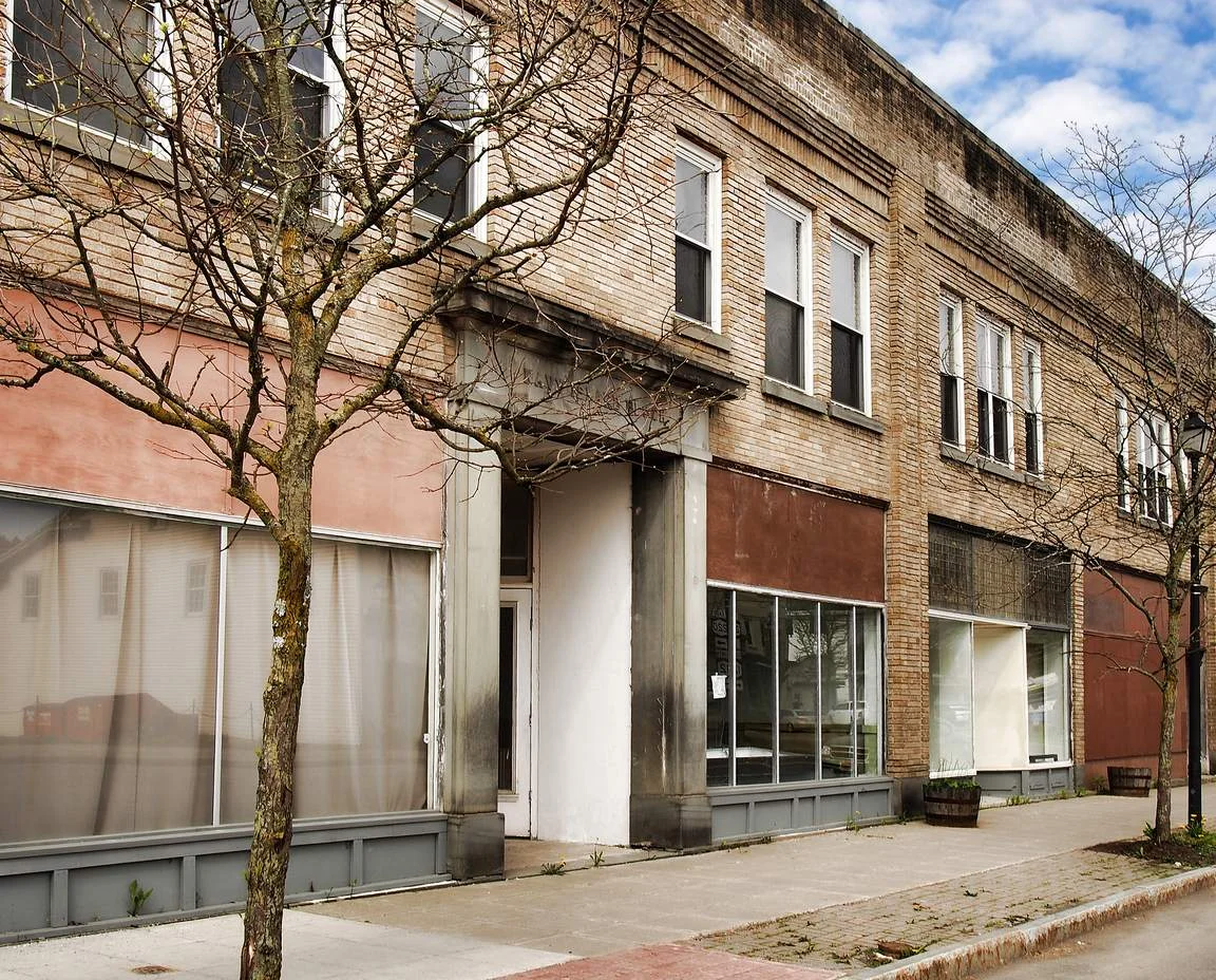 Small commercial storefront exterior in daylight