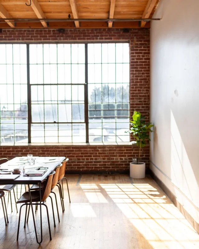 Small professional office with a few desks, unoccupied