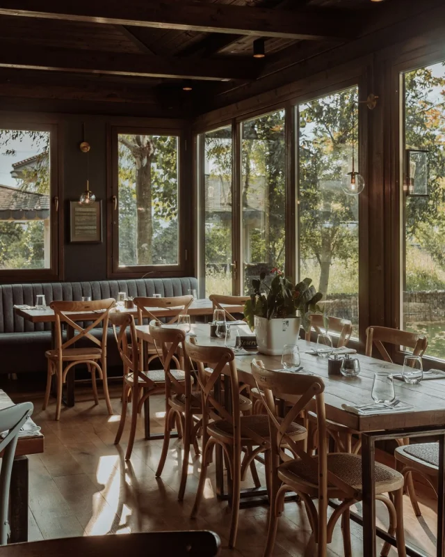 Small restaurant interior with tables and a service counter