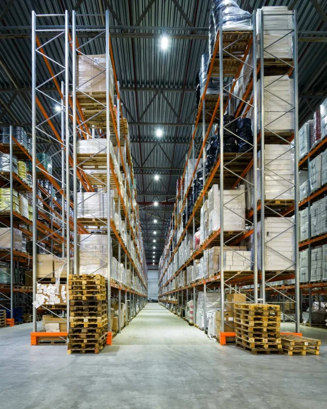 Warehouse interior with steel racking and palletised goods