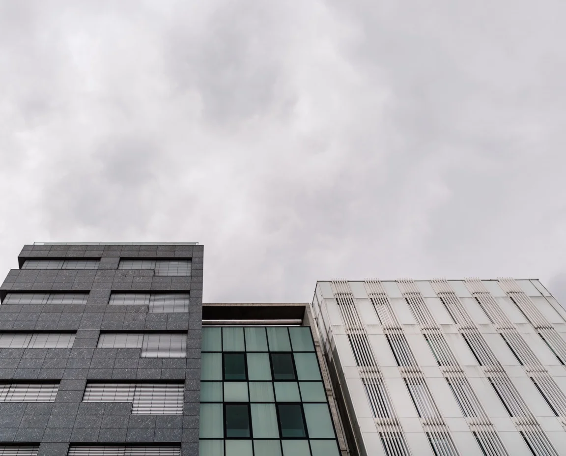 Upper storeys of a commercial building against daylight sky
