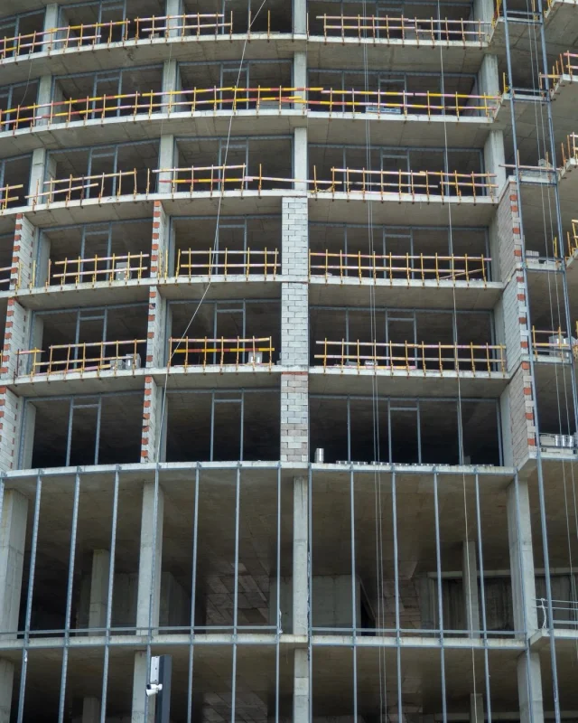 Scaffolding against a partly built structure