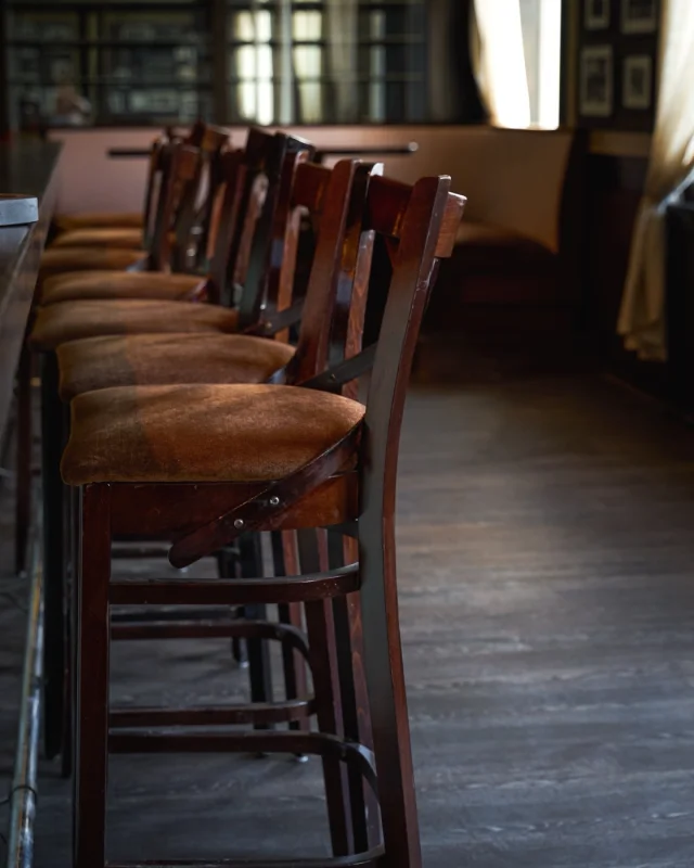 Empty restaurant interior with tables and a service counter