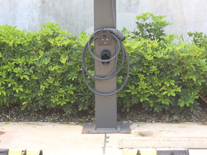 Outdoor electric vehicle charge point on its pedestal with the lead stowed
