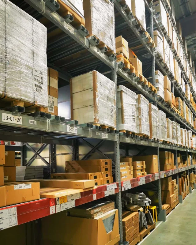 Warehouse aisle with palletised goods on steel racking