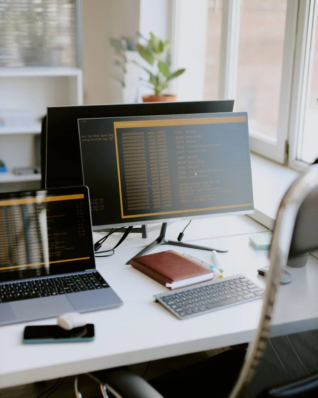 Workstation with a keyboard and monitor on a plain desk