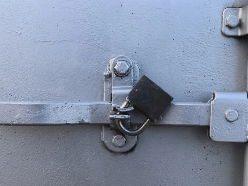 Padlocked site storage box on a construction site
