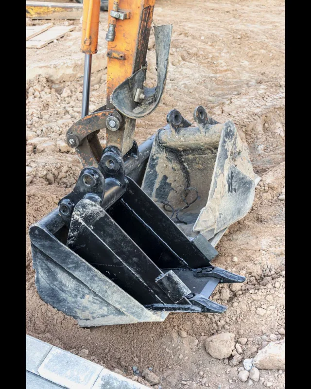 Compact excavator standing on a construction site