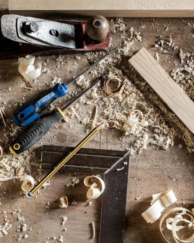Hand and power tools racked inside a work van
