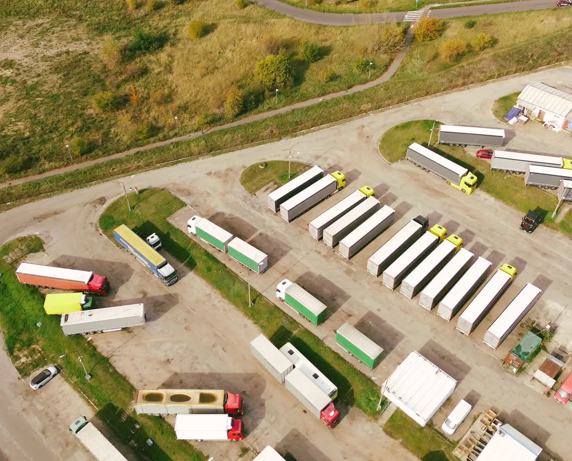 Aerial view of a haulage depot yard with trailers parked in rows