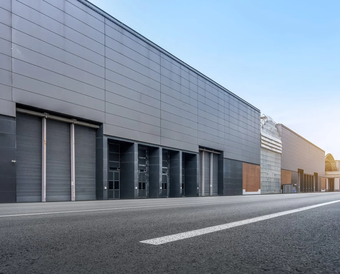 Industrial building exterior with a row of closed loading bays