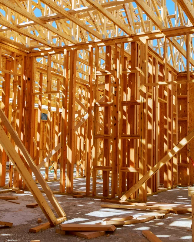 Timber framing of a house under construction, offcuts on the slab
